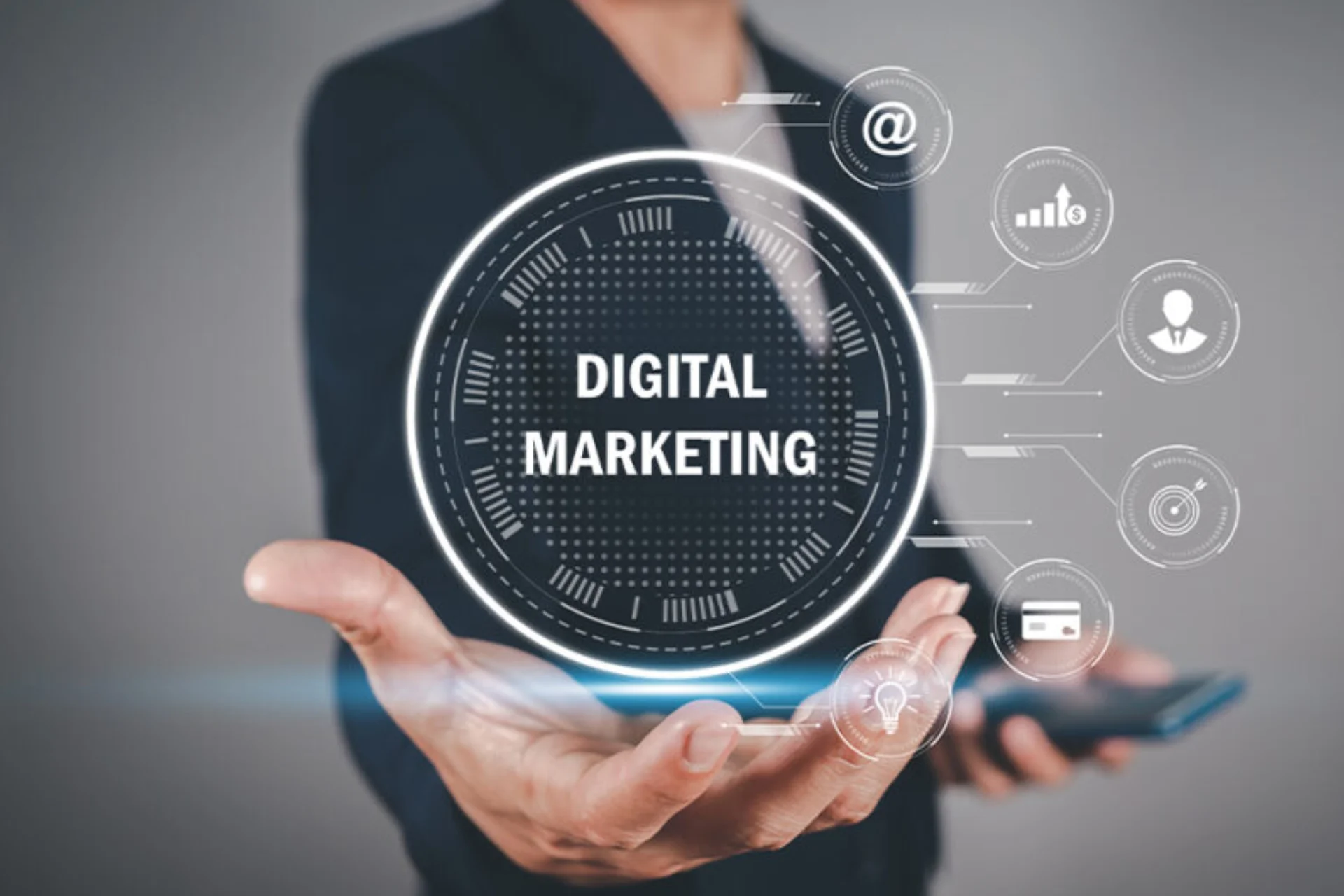Hand holding digital marketing icons, symbolizing online marketing strategies and tools for business growth and engagement