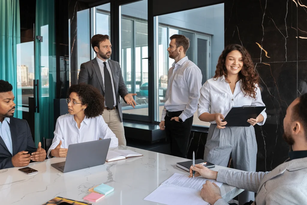 Business team in an office setting, engaged in discussions to foster global business growth and collaboration