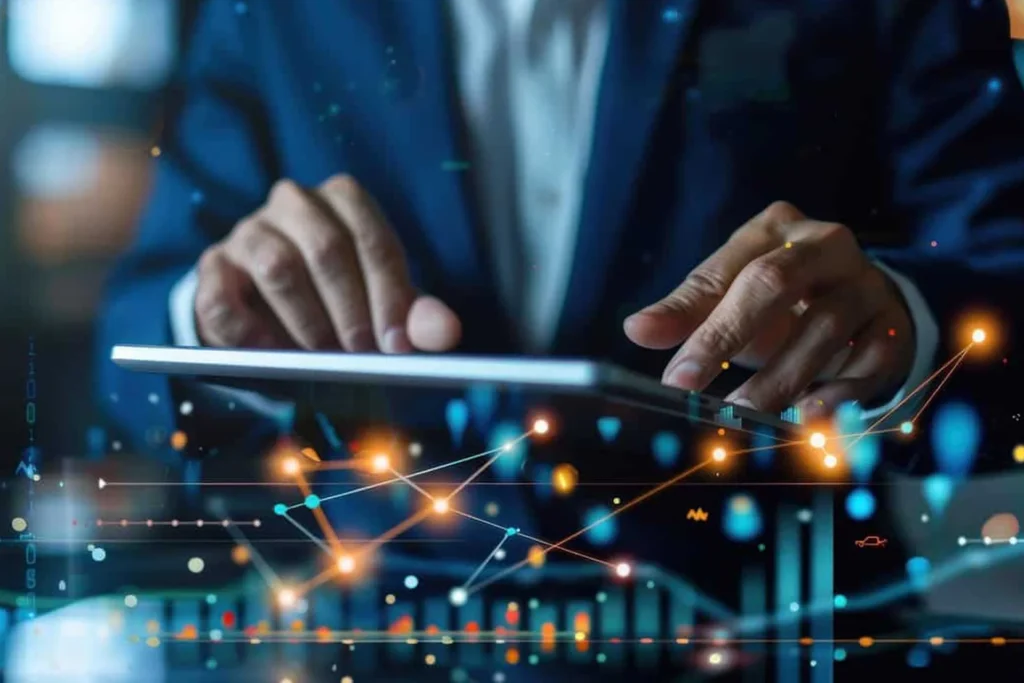 Businessman analyzing data and graphs on a tablet, showcasing FinTech innovation in action