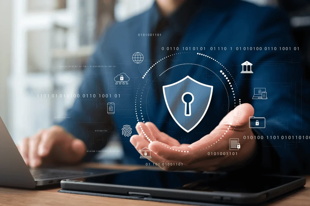 Businessman holding a laptop displaying a security icon, emphasizing retail security and compliance