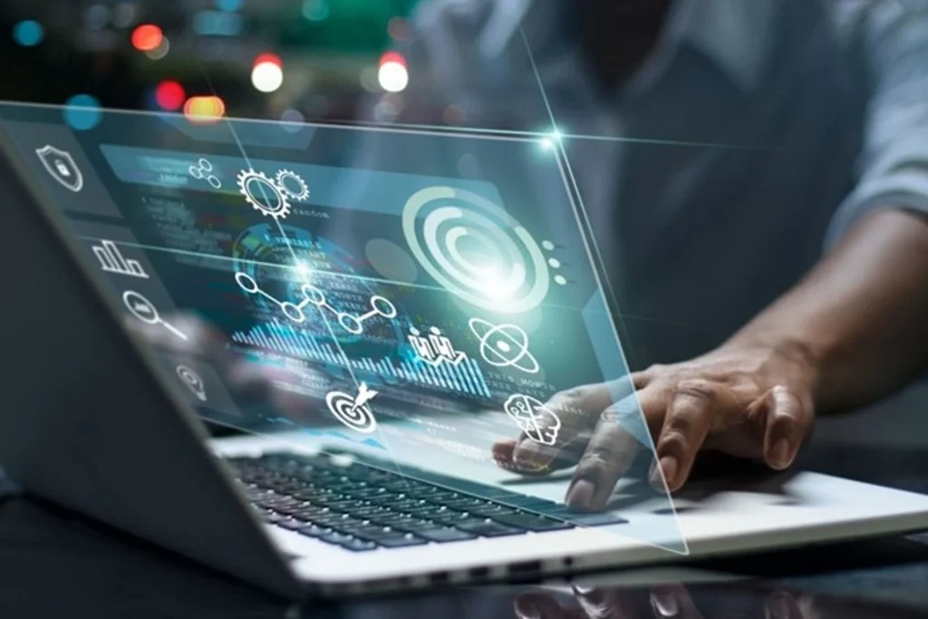 Individual using a laptop with a digital interface, illustrating the concept of digital transformation consulting