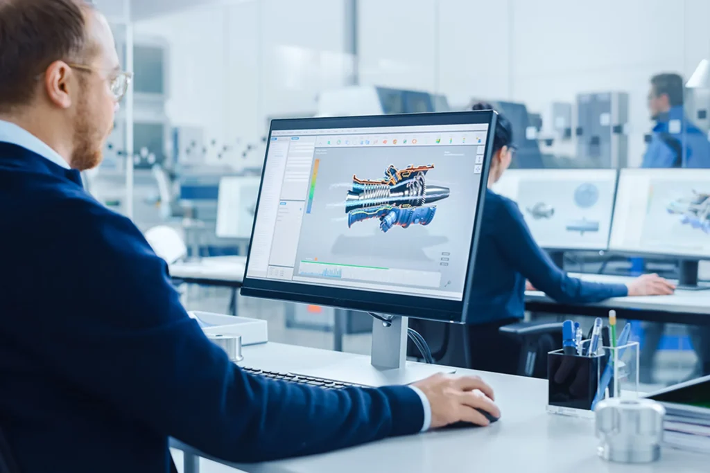Man working on a computer in an office, focused on product visualization and demo animations