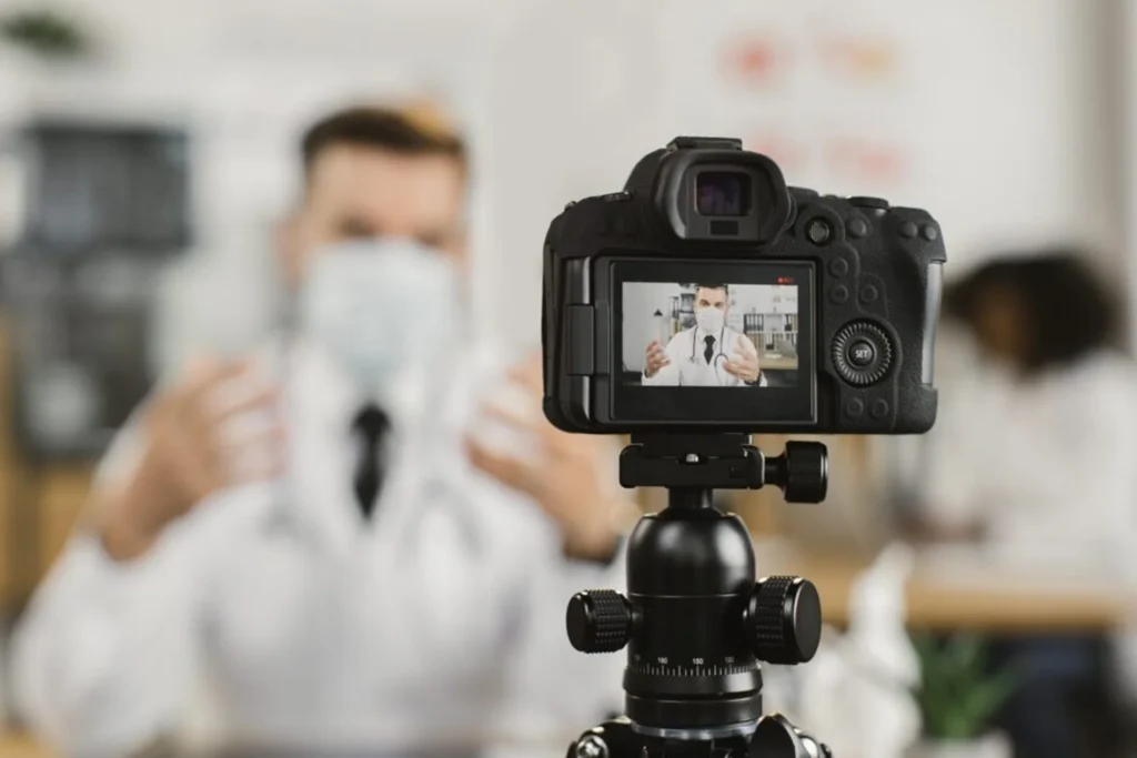 A doctor holds a camera, symbolizing impactful healthcare video production