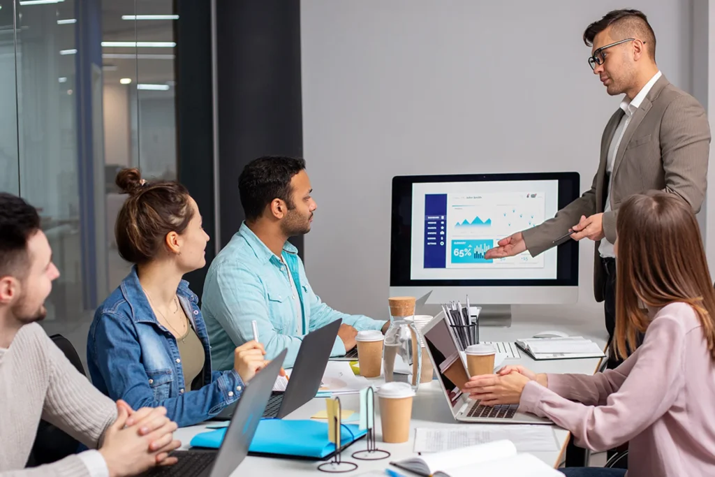 A man presents to an audience on campaign planning and execution strategies