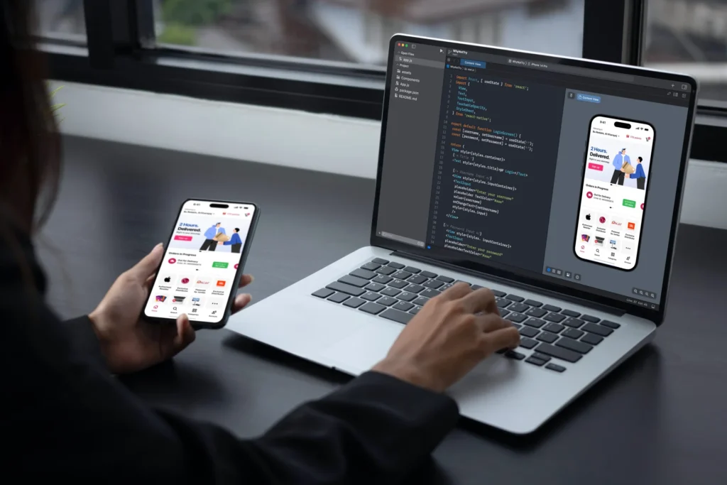 A man with a smartphone stands in front of a computer screen showcasing industry-specific solutions